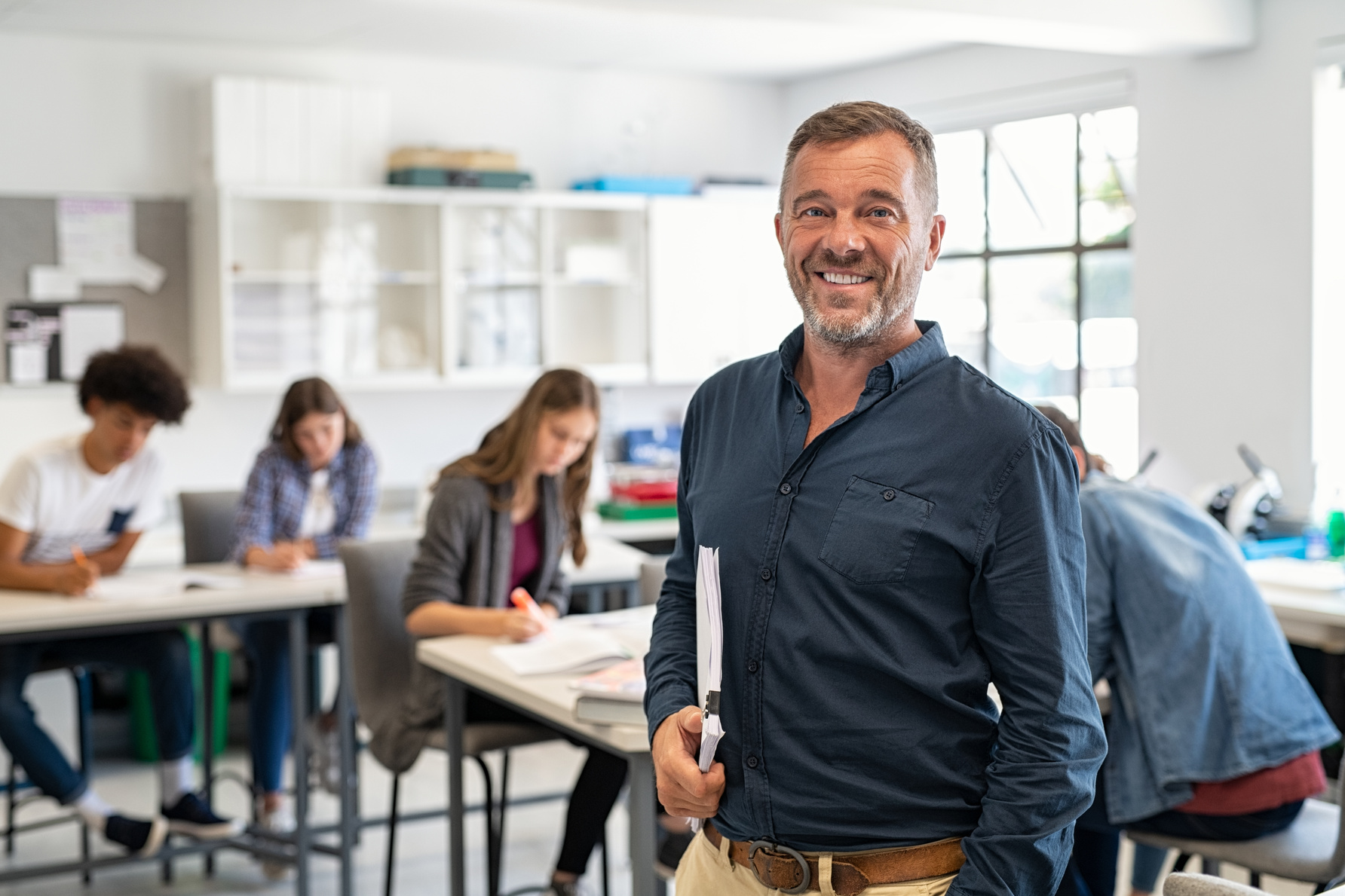 Mature Male Professor Standing in Class