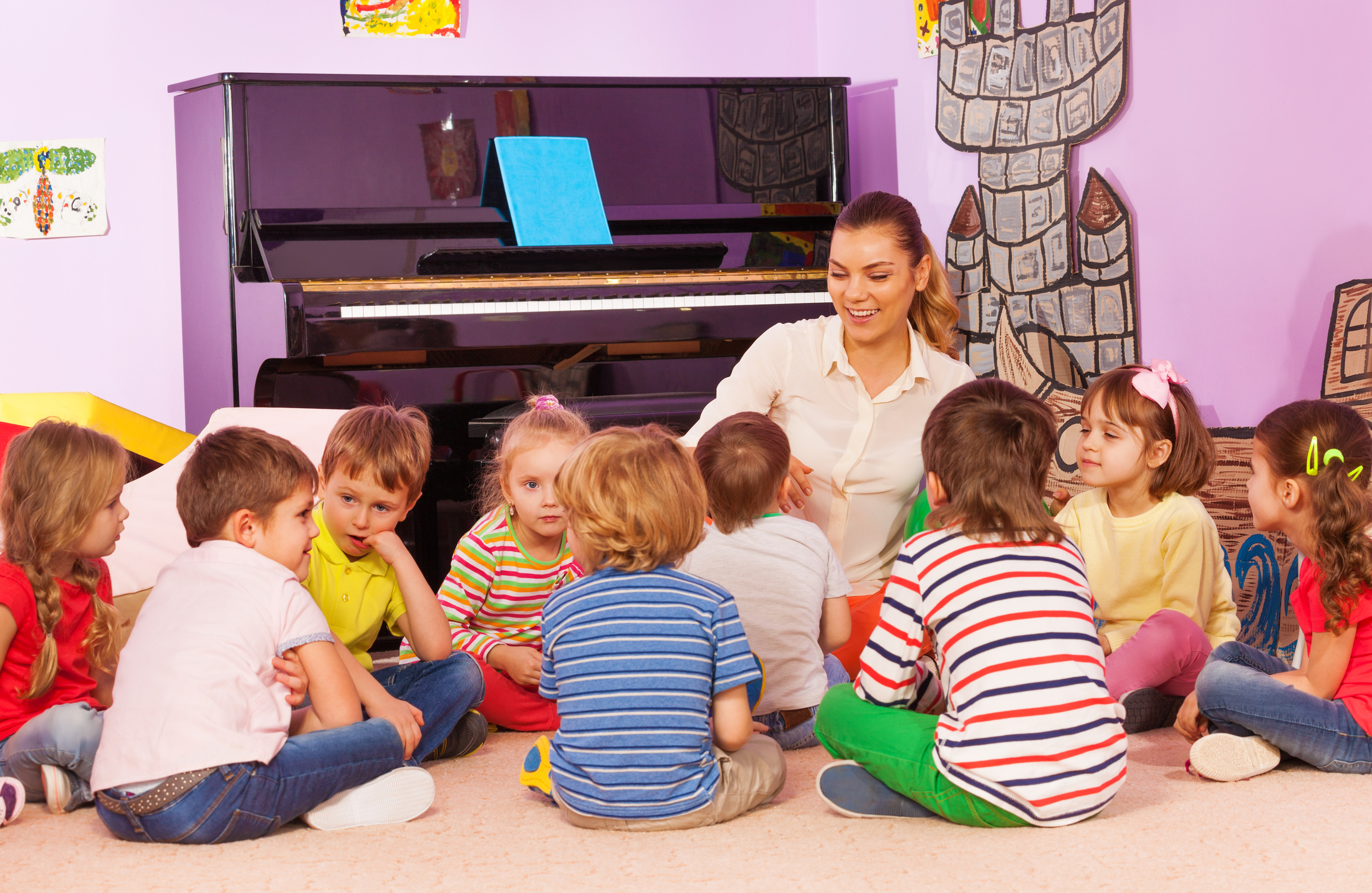 Kids Sit and Listen to Teacher 