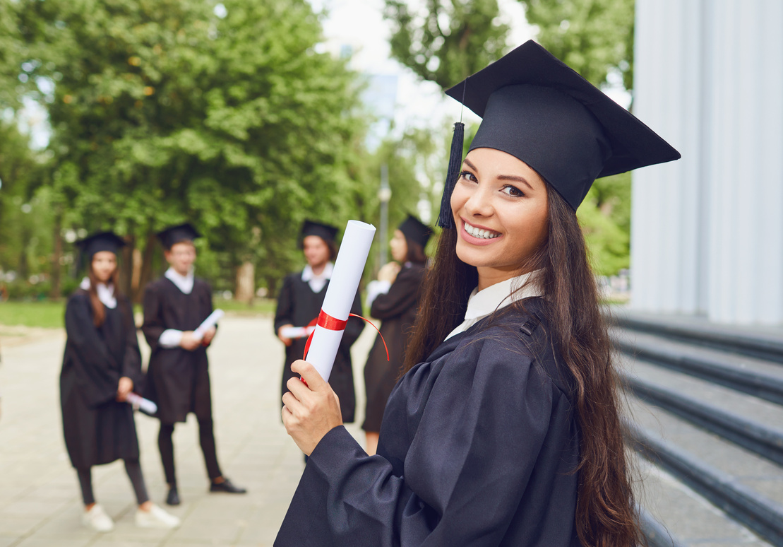 Happy Young Graduates at University