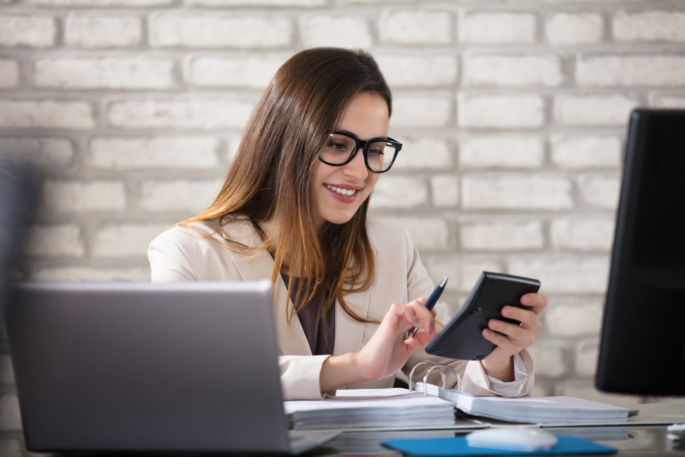 Smiling Accountant Using Calculator