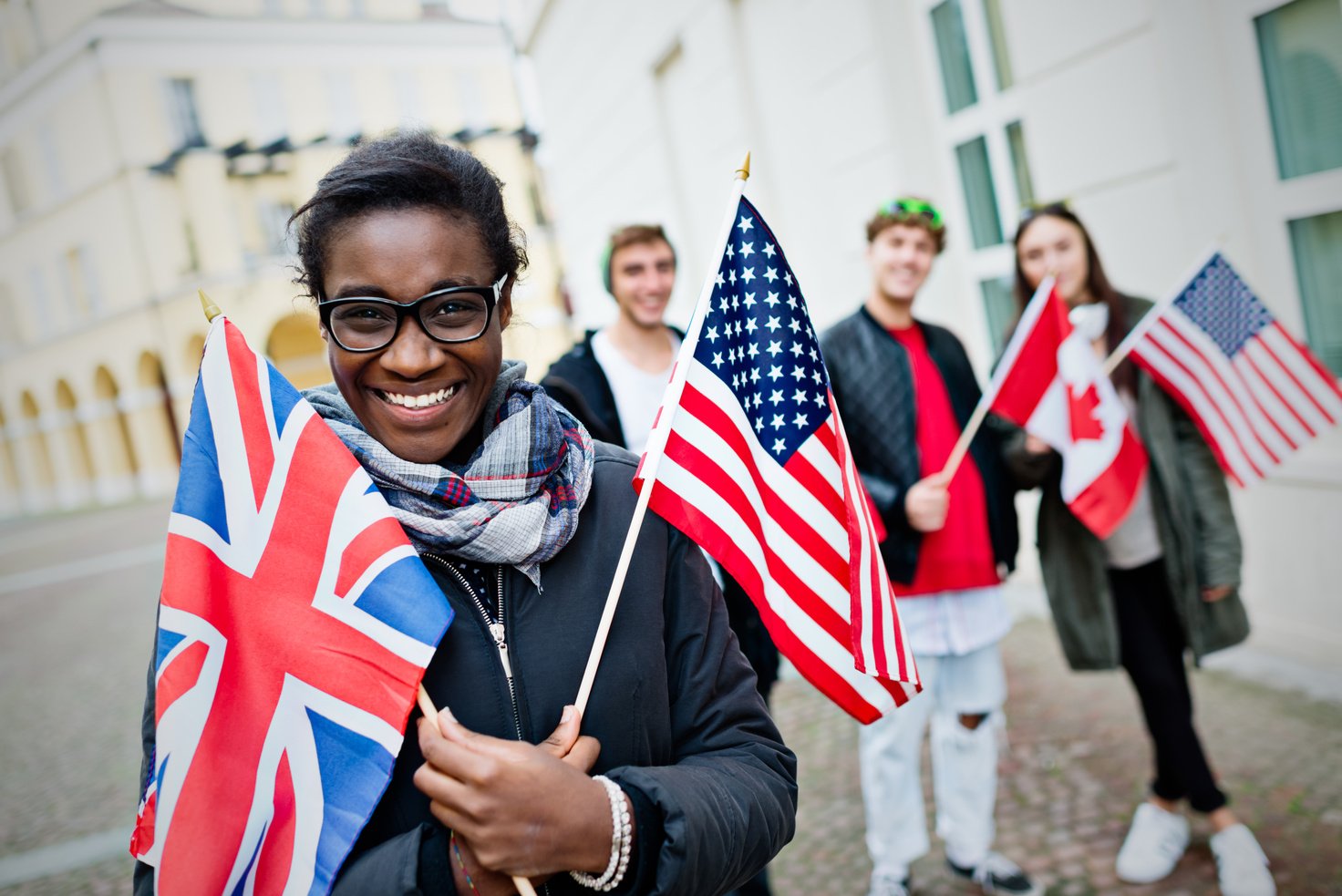 Group of students with flags of English language countries